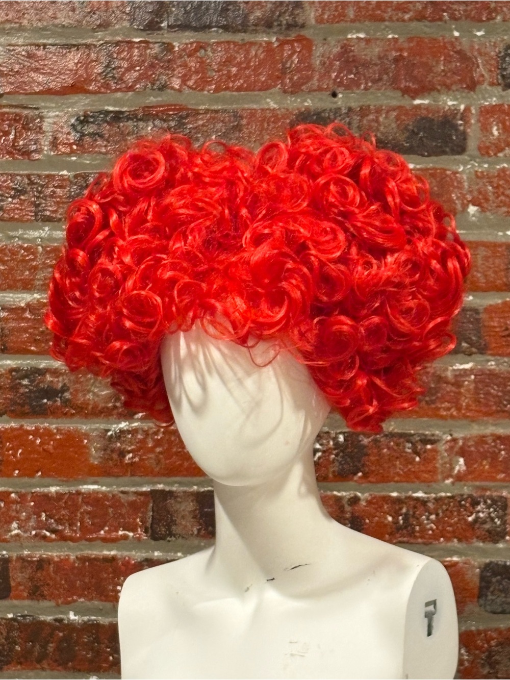 Party City Vibrant Queen of Hearts Women's Wig with heart scepter